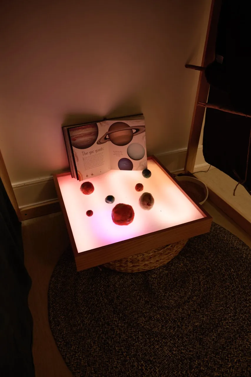 Children exploring light and colour in an early learning activity